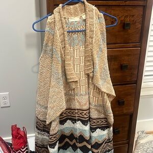 Sleeveless sweater. Long